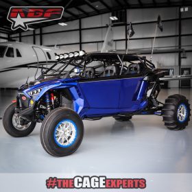 rzr pro r 4 seater with blue paint in front of a jet.