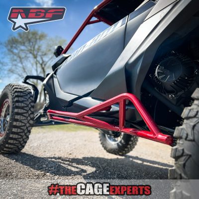 can am maverick R with Red tree kickers and roll cage