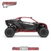 can am maverick r with a red aftermarket roll cage and red aftermarket rock sliders