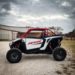 2024 rzr xp 1000 with red aftermarket roll cage