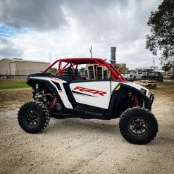 2024 rzr xp 1000 with red aftermarket roll cage