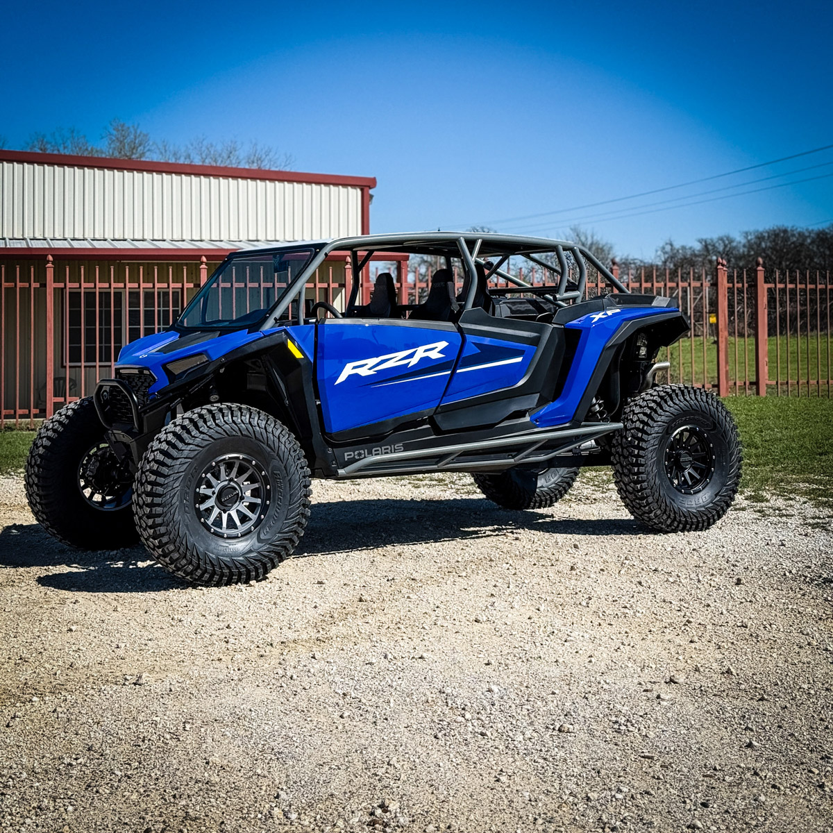 Blue rzr xp 4 seat with aftermarket rollcage