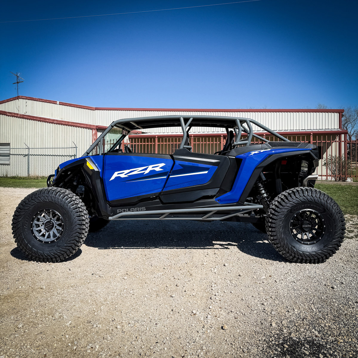 Blue rzr xp 4 seat with aftermarket rollcage