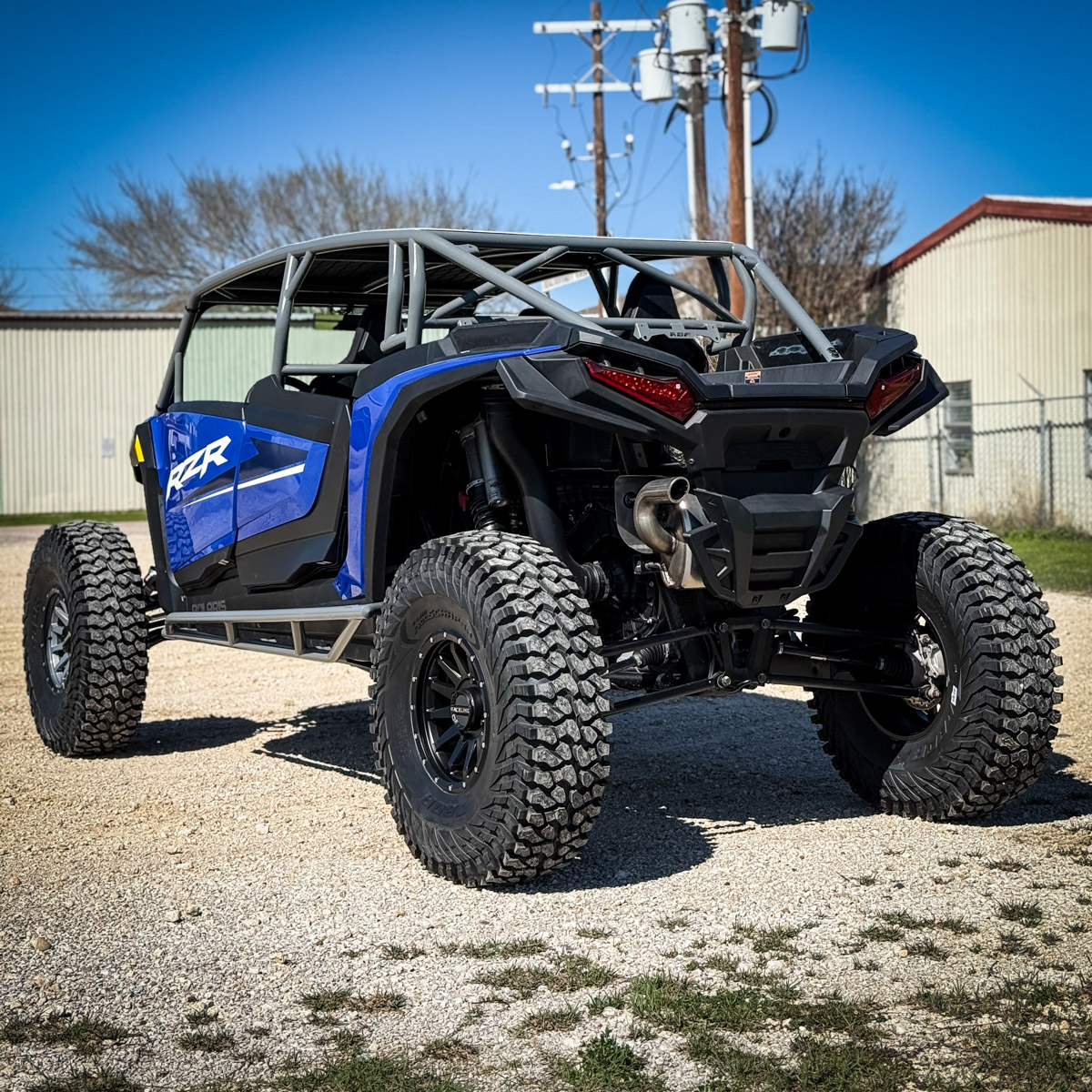 Blue rzr xp 4 seat with aftermarket rollcage