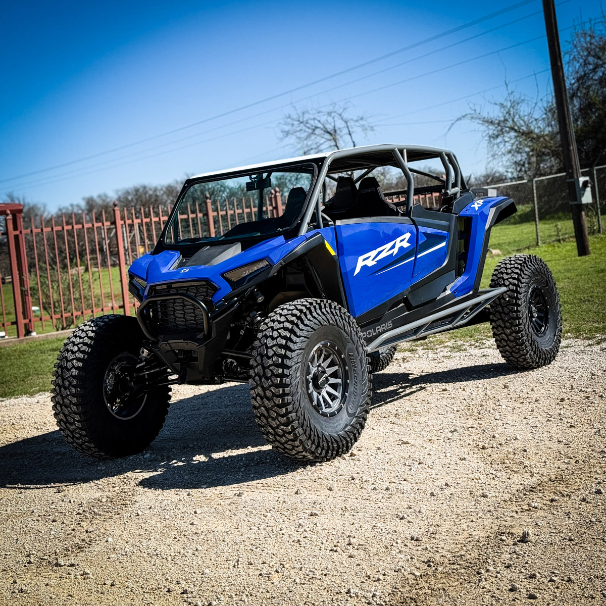 Blue rzr xp 4 seat with aftermarket rollcage